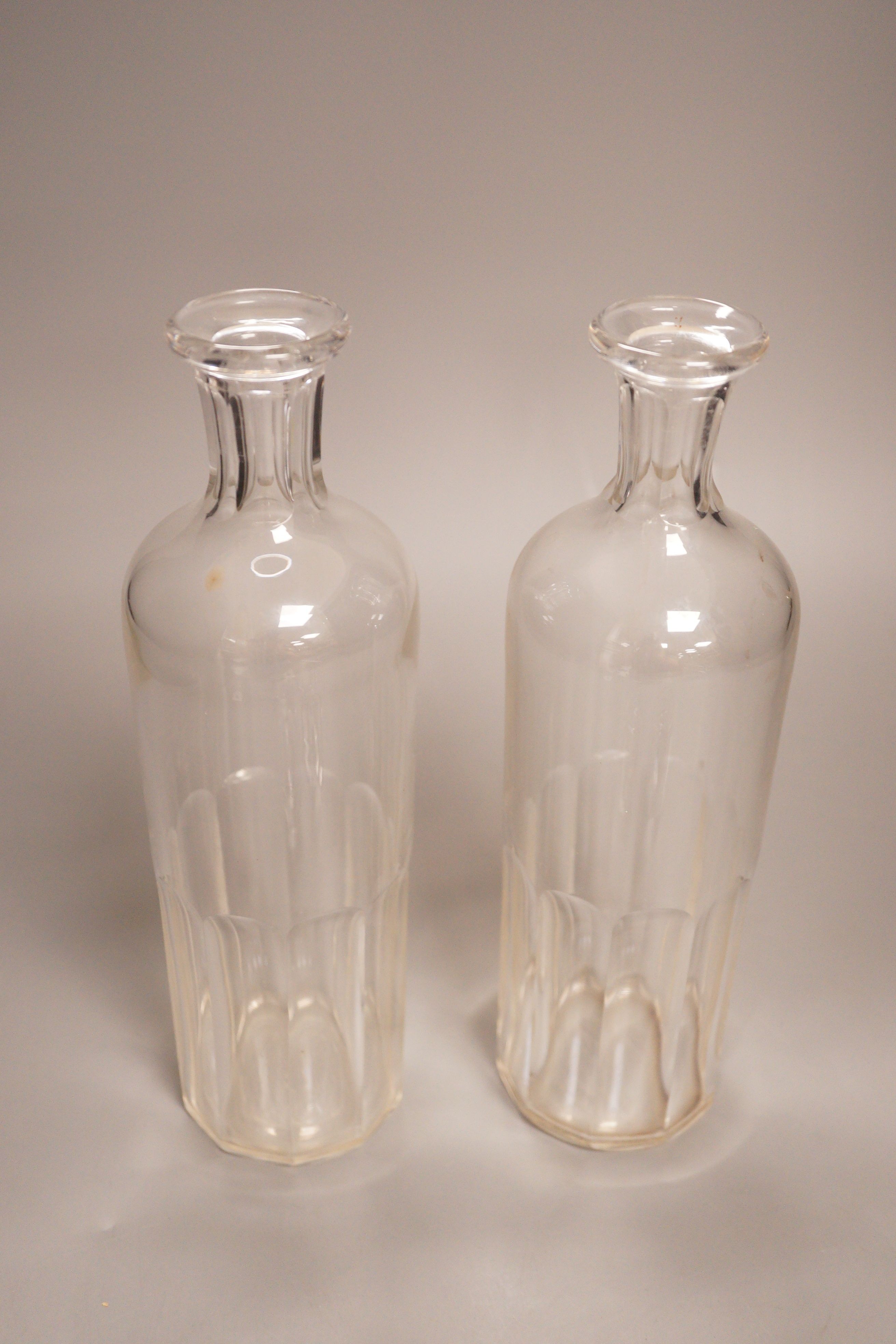 A pair of Baccarat for Hermes glass decanters, 29cm